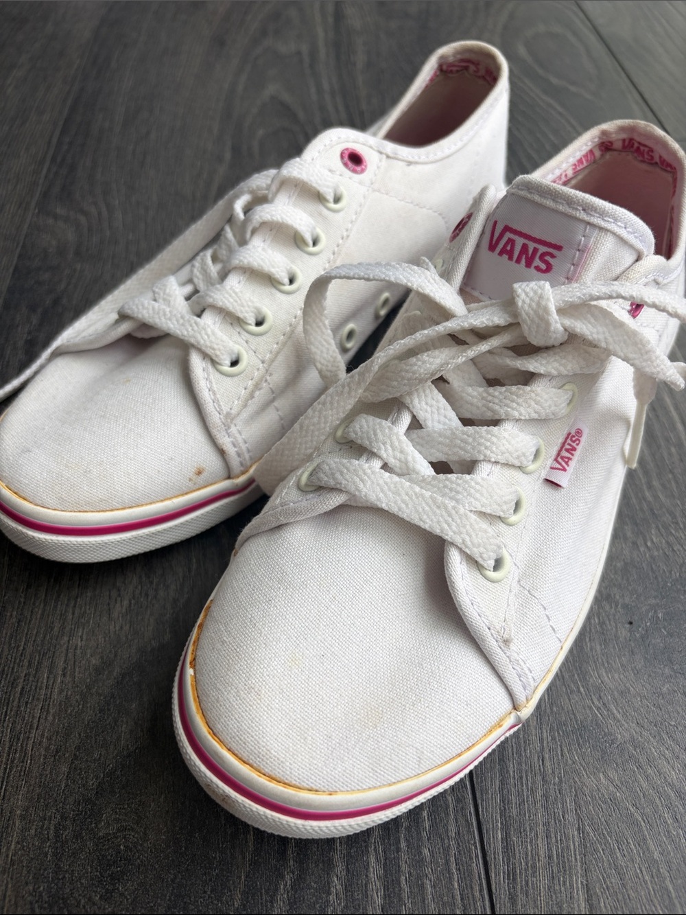 Never worn White vans with pink trim. Size 7